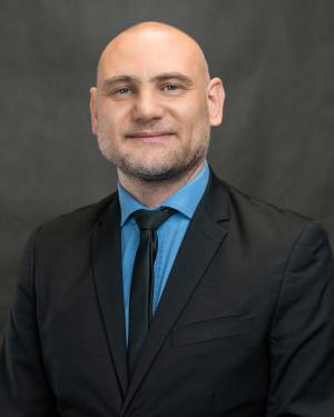Dr Adrian Robak